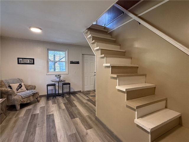 stairway with hardwood / wood-style floors