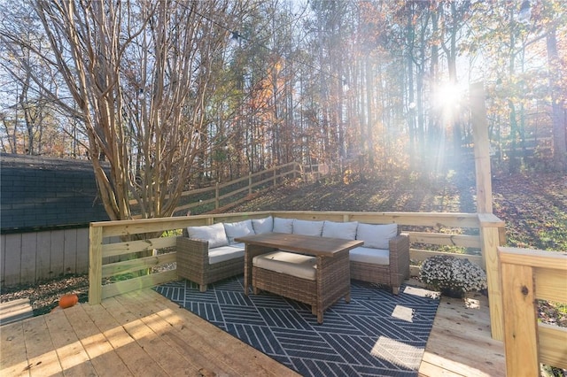 wooden deck featuring fence and an outdoor hangout area