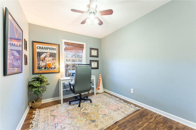 home office featuring a ceiling fan, baseboards, and wood finished floors