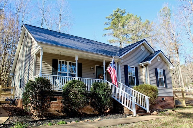 view of front of home featuring a porch and crawl space