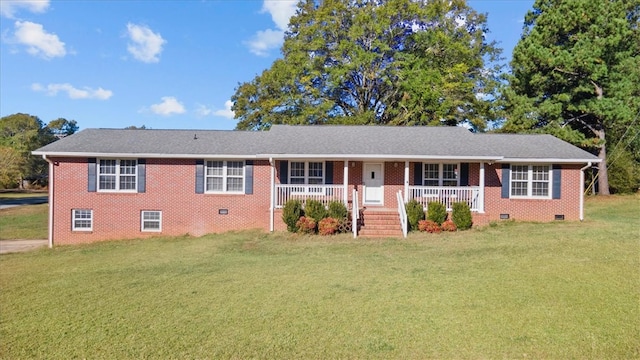 ranch-style house with a front lawn and covered porch