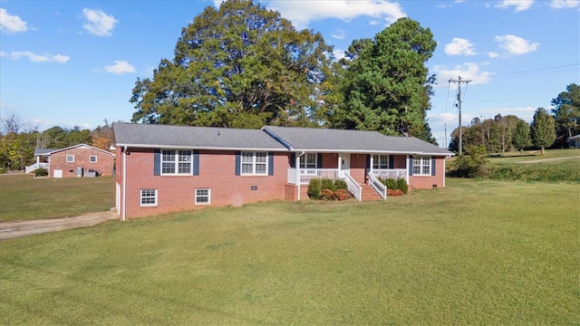 view of front of property with a front lawn and covered porch