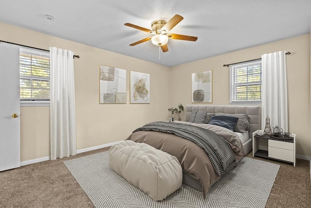 bedroom with carpet, multiple windows, and ceiling fan