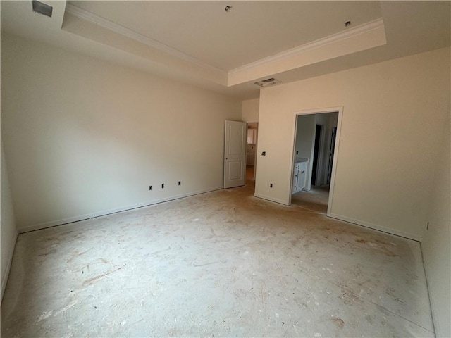 unfurnished bedroom featuring visible vents, a raised ceiling, and ornamental molding