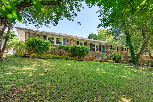 ranch-style home with a front yard