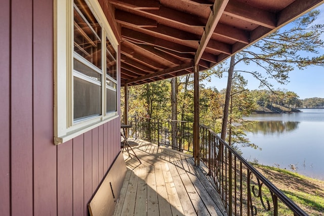 wooden terrace with a water view