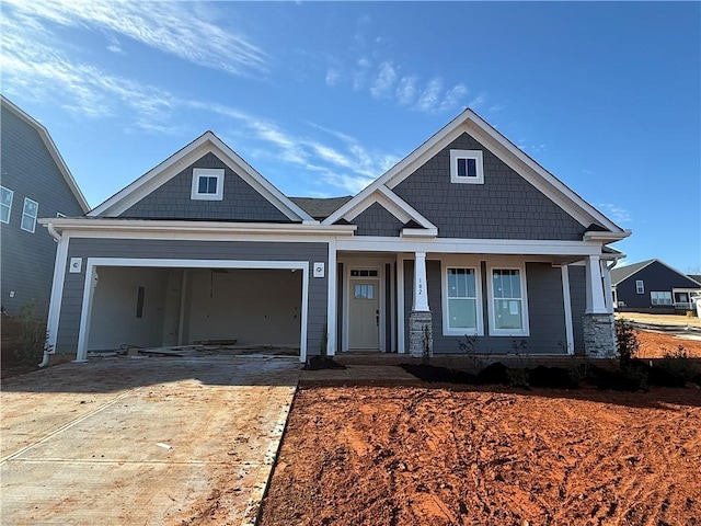 view of front facade featuring a garage and covered porch