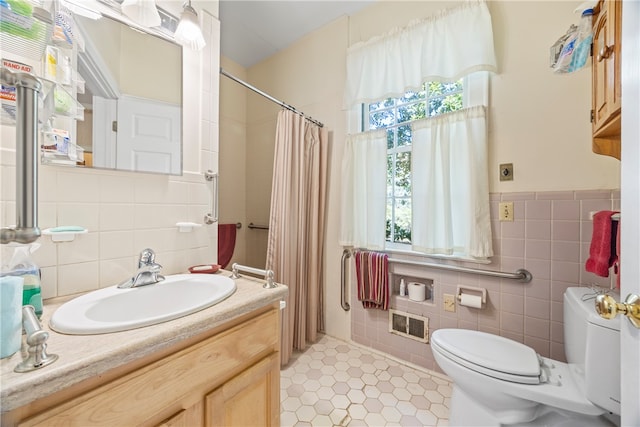 bathroom featuring tile patterned flooring, toilet, vanity, tile walls, and a shower with shower curtain