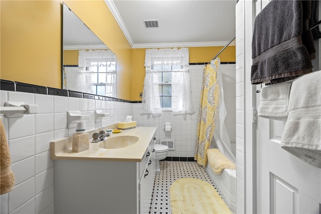 full bathroom featuring vanity, toilet, tile walls, and ornamental molding