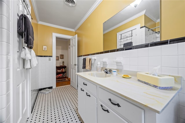 bathroom featuring vanity, tile walls, and ornamental molding