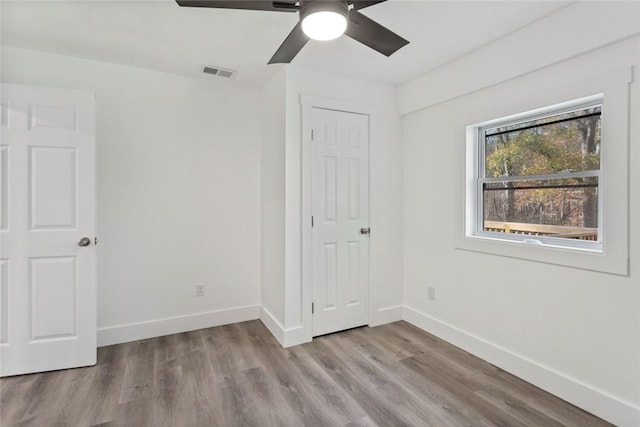 unfurnished bedroom featuring ceiling fan and light hardwood / wood-style flooring