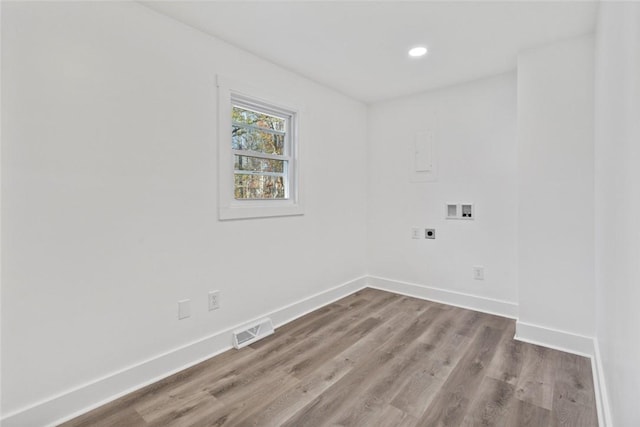 laundry room featuring hardwood / wood-style floors, electric dryer hookup, and hookup for a washing machine