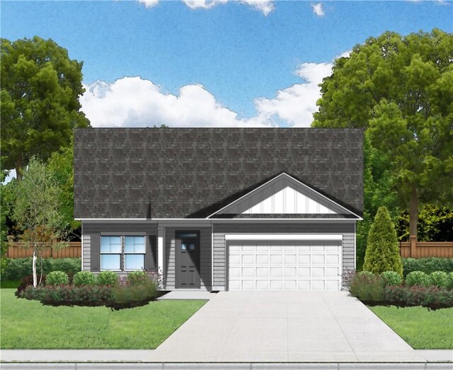 view of front of home featuring a garage and a front lawn