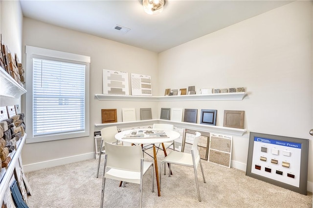 recreation room with light carpet