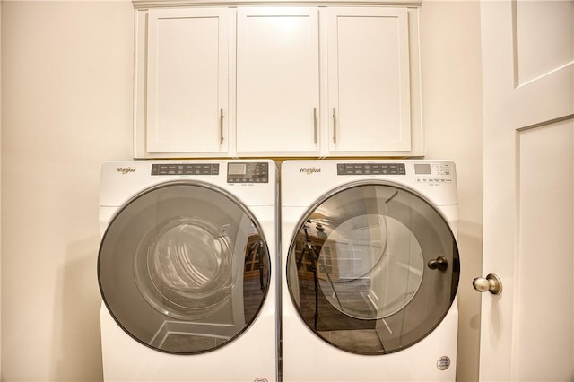 laundry area featuring cabinets and separate washer and dryer