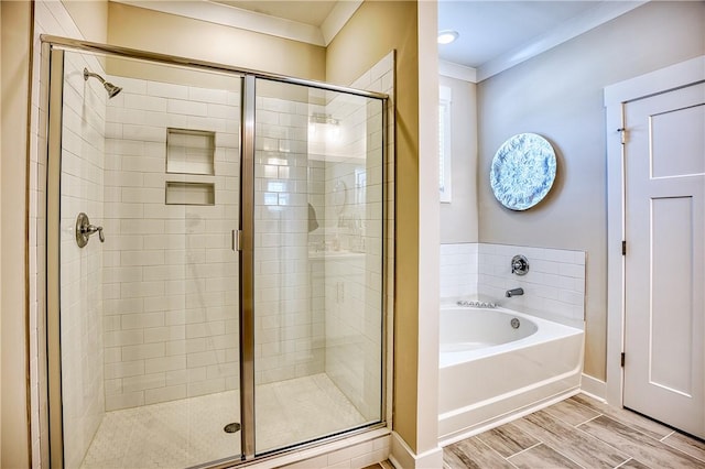 bathroom featuring crown molding and independent shower and bath