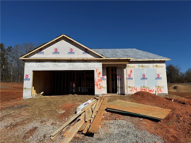 unfinished property featuring a garage