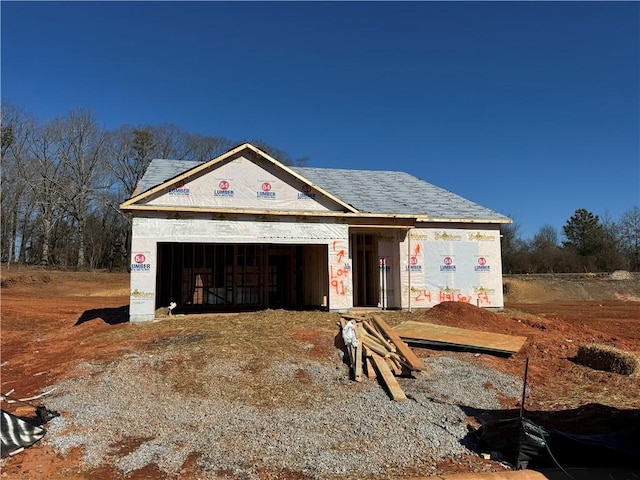 property in mid-construction with an outbuilding and a garage