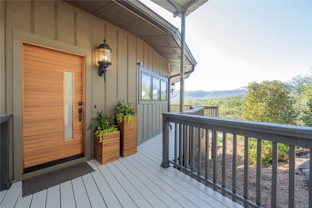 wooden deck featuring a mountain view