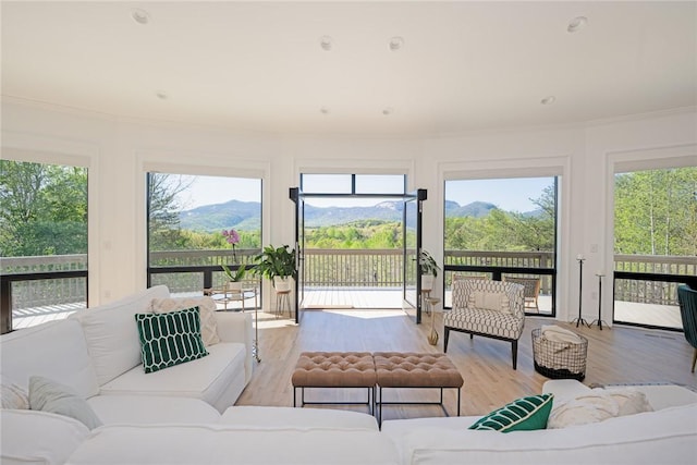 sunroom with a mountain view