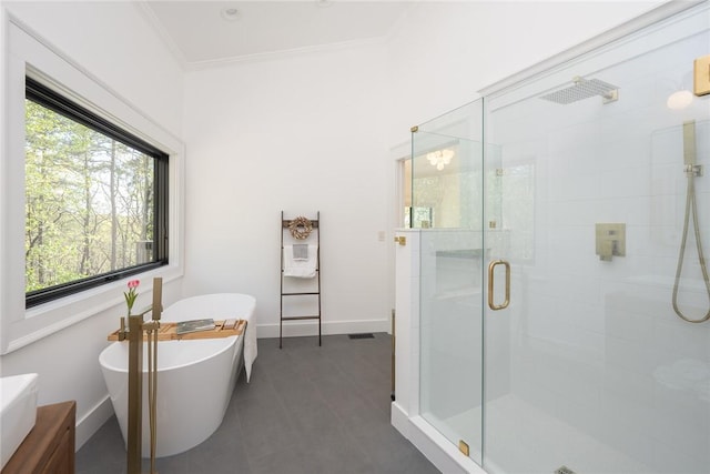 bathroom with ornamental molding, vanity, and independent shower and bath