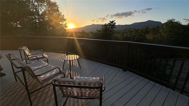 deck at dusk with a mountain view