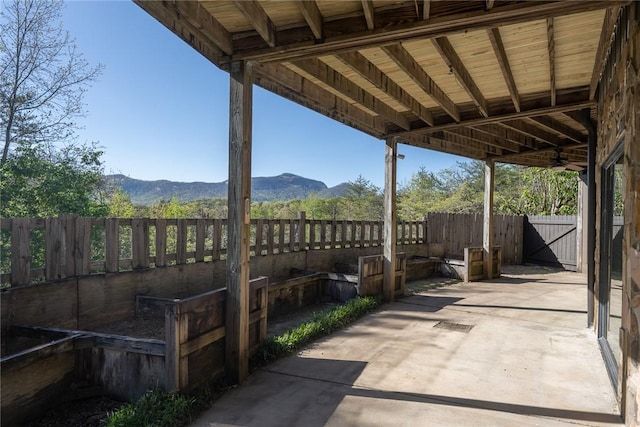 view of patio / terrace featuring a mountain view