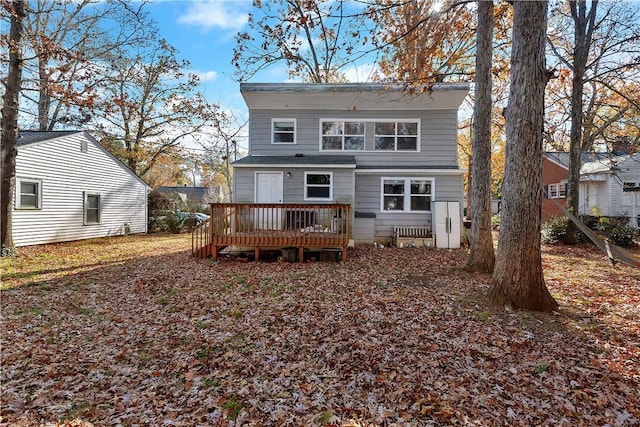 back of house with a wooden deck