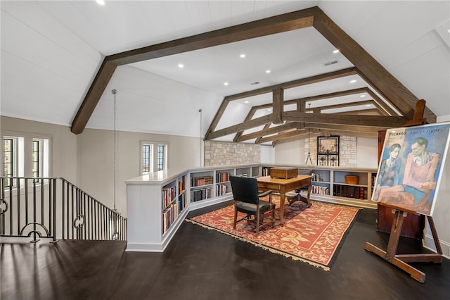 dining area featuring lofted ceiling with beams