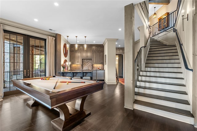 recreation room with an inviting chandelier, dark wood-type flooring, pool table, and french doors