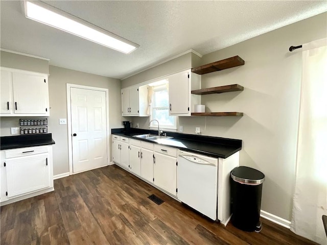 kitchen featuring white dishwasher, sink, a textured ceiling, dark hardwood / wood-style flooring, and white cabinetry