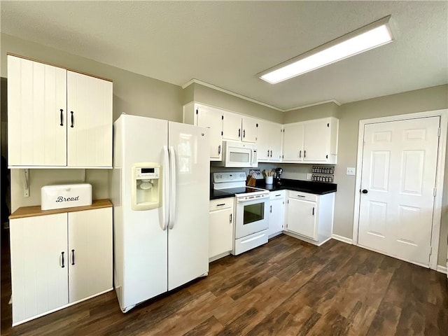 kitchen featuring white appliances, dark hardwood / wood-style floors, and white cabinetry