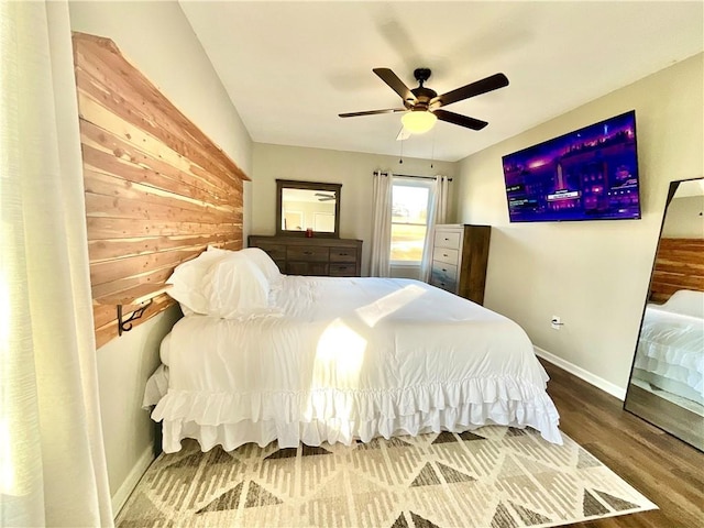 bedroom with ceiling fan and wood-type flooring