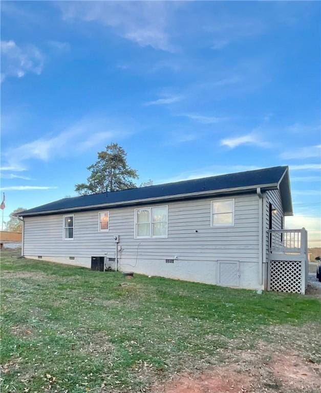 rear view of house with a lawn