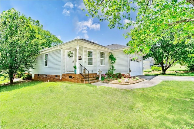 ranch-style house featuring a garage and a front lawn