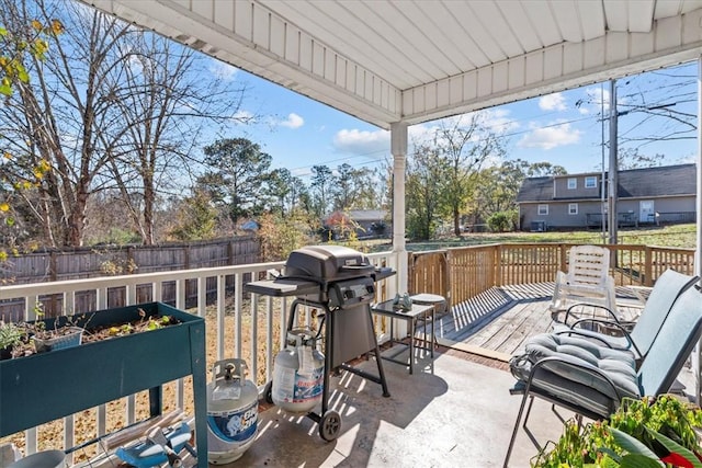 view of patio featuring area for grilling and a wooden deck