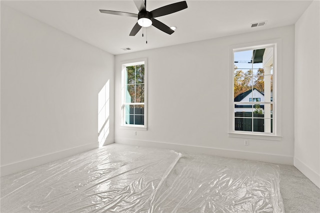 carpeted empty room with ceiling fan