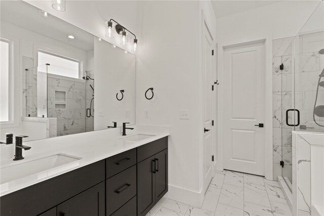 bathroom featuring vanity and an enclosed shower