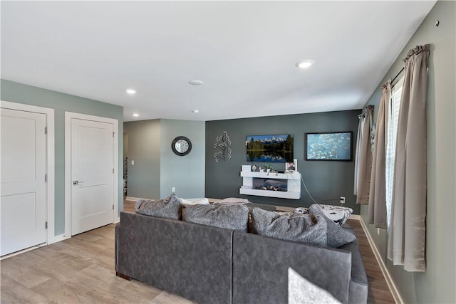 living room with light hardwood / wood-style floors