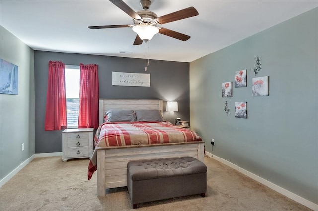 bedroom featuring ceiling fan and light carpet