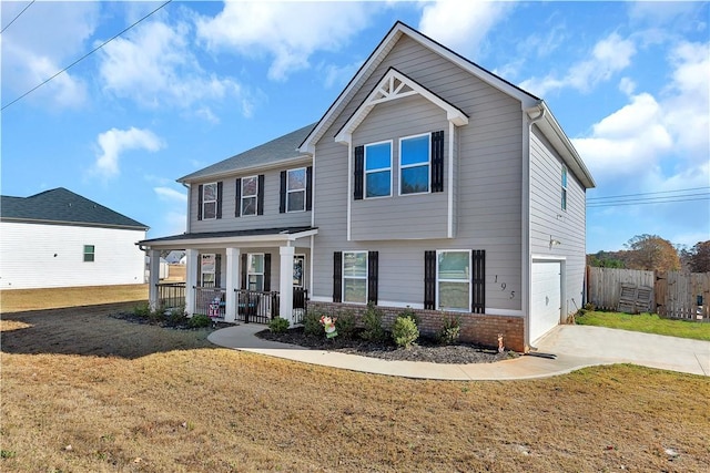 craftsman inspired home featuring a front lawn, covered porch, and a garage