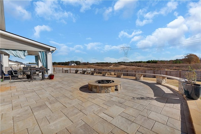 view of patio featuring an outdoor fire pit