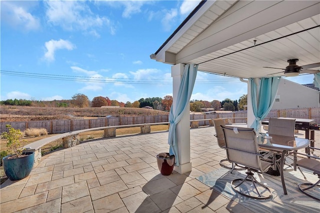 view of patio featuring ceiling fan