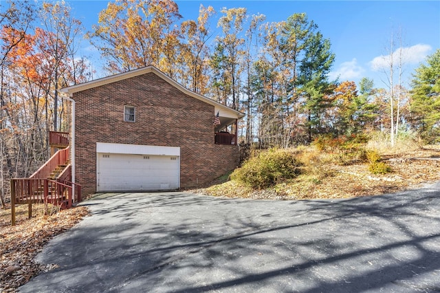 view of side of property with a garage