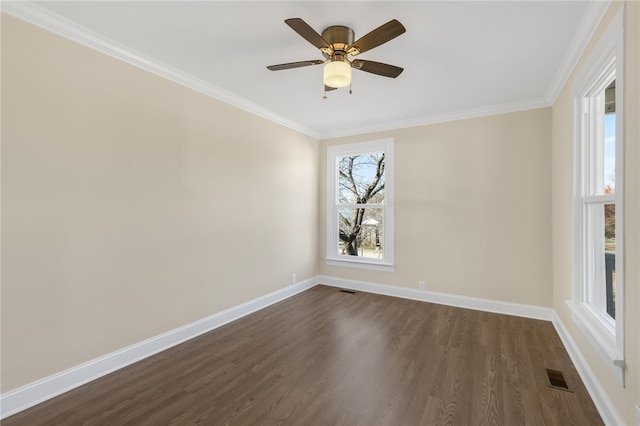 empty room featuring crown molding, ceiling fan, and dark wood-type flooring