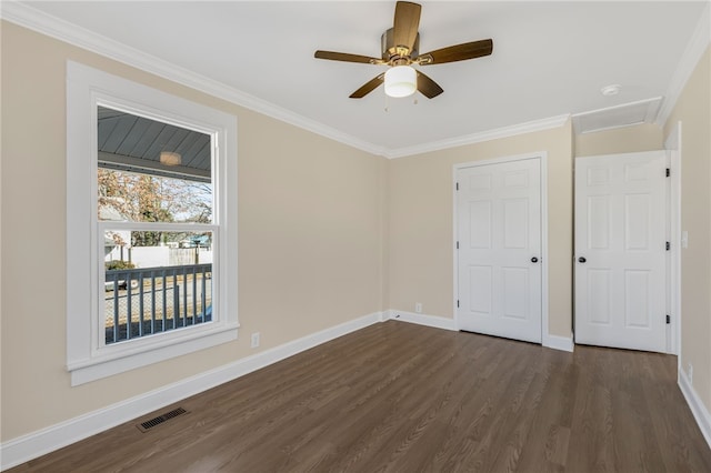 unfurnished bedroom with ceiling fan, crown molding, and dark wood-type flooring