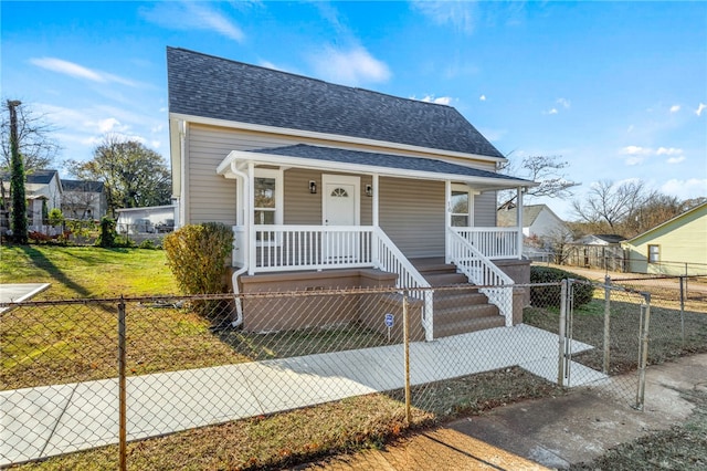 bungalow-style house with covered porch and a front lawn