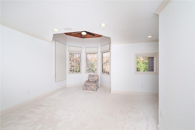 carpeted empty room featuring ornamental molding