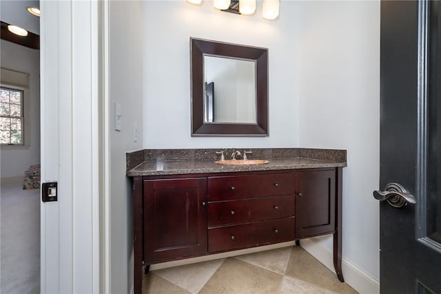 bathroom featuring tile patterned flooring and vanity