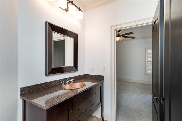 bathroom featuring vanity, ceiling fan, and ornamental molding